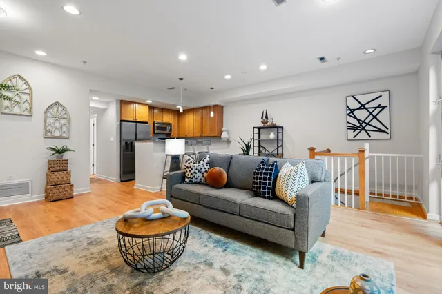a living room with furniture and a table