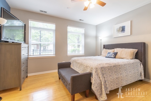 757 West 14th Street, Unit 1B Chicago, IL 60607 - Photo 9 of 13 a bedroom with a bed and a couch