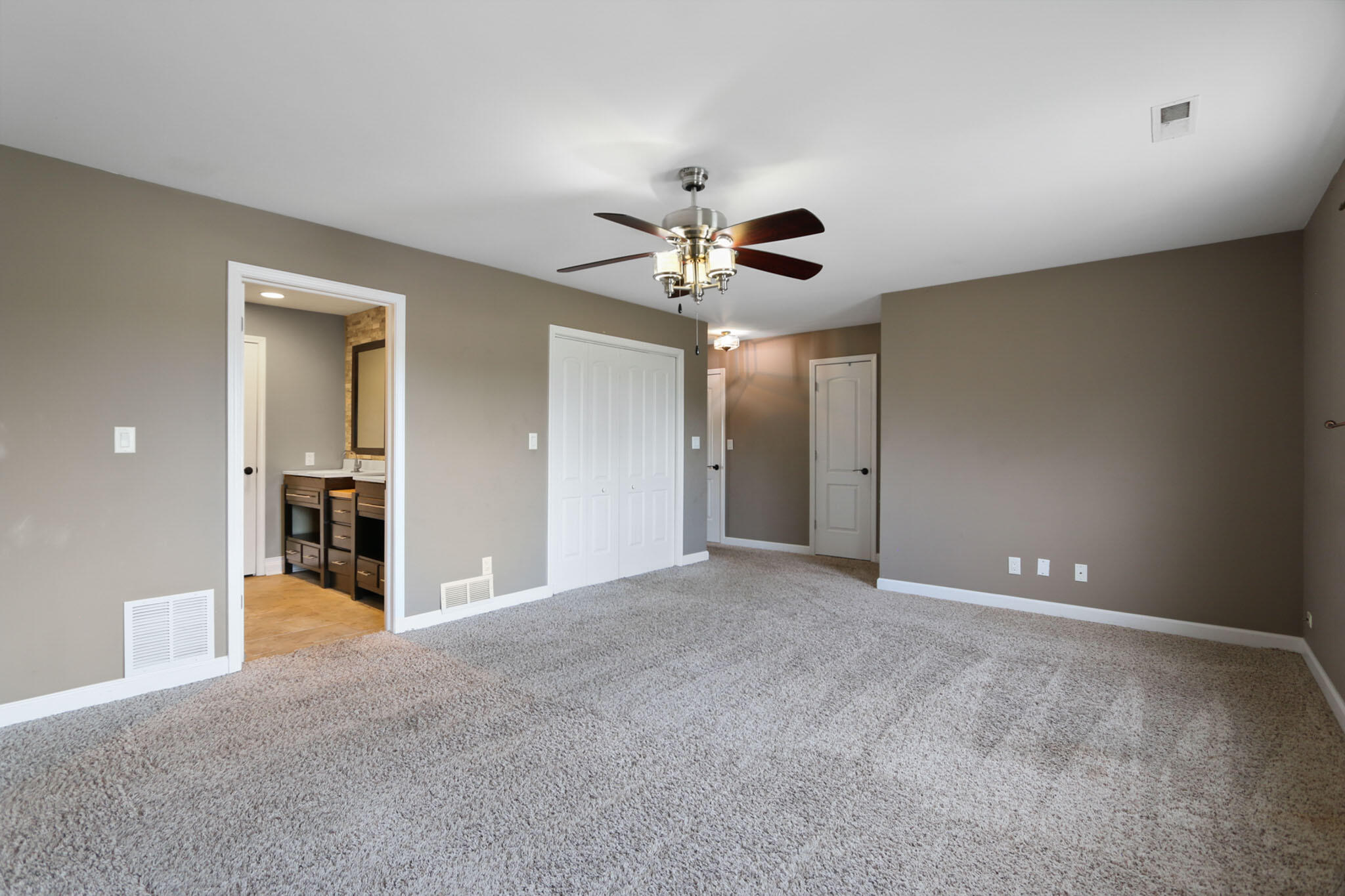 366 Devon Court Valparaiso, IN 46385 - Photo 23 of 45 a view of a livingroom with a chandelier fan and a ceiling fan