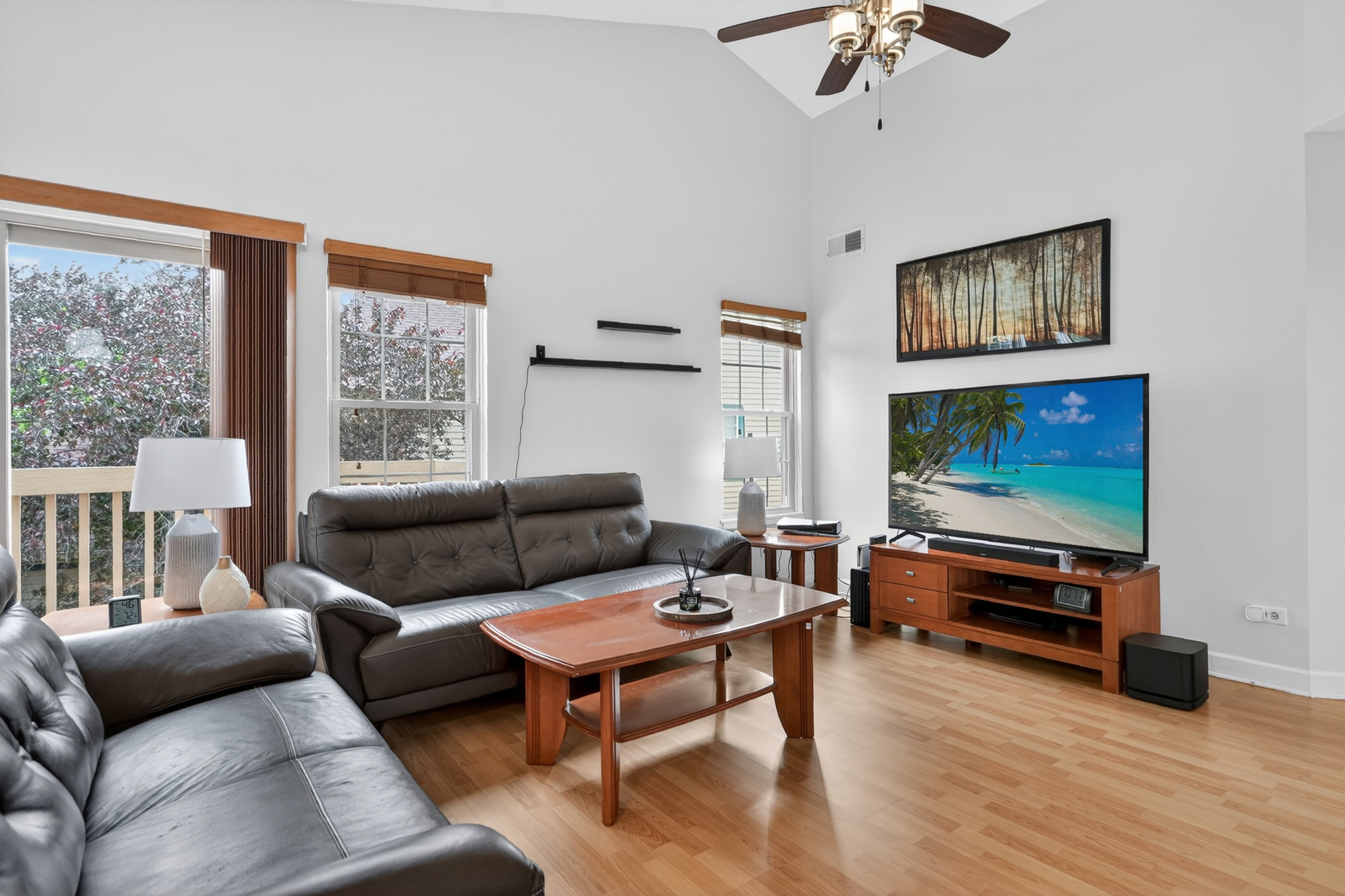 943 Ridgefield Lane, Unit 4 Wheeling, IL 60090 - Photo 7 of 38 a living room with furniture and a flat screen tv