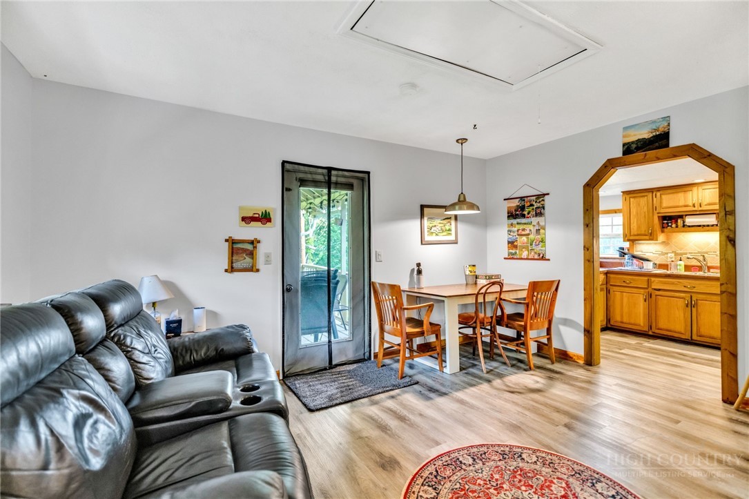 242 Ladd Parson Road Crumpler, NC 28617 - Photo 12 of 36 a living room with furniture and wooden floor