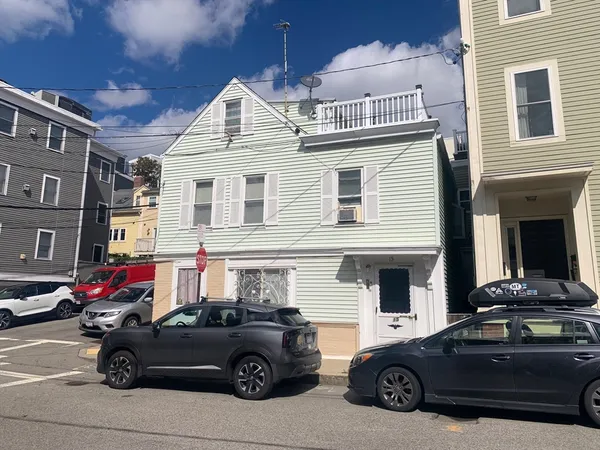 a car parked in front of a house