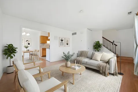 a bathroom with a toilet sink vanity and mirror
