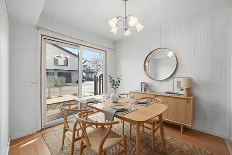 a bedroom with a bed and a chair