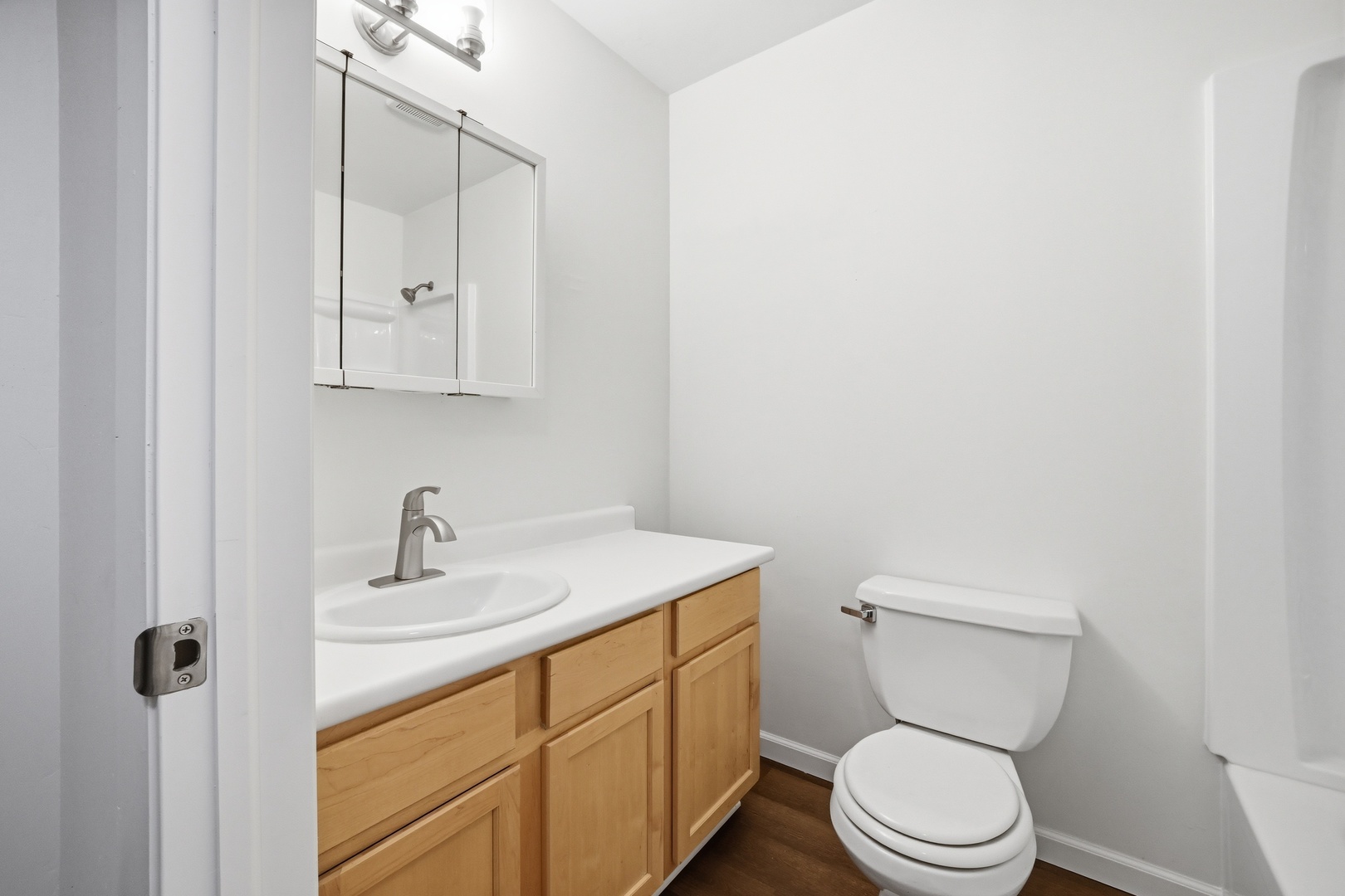 1729 Cedarbrook Court Sycamore, IL 60178 - Photo 22 of 36 a bathroom with a toilet sink vanity and mirror