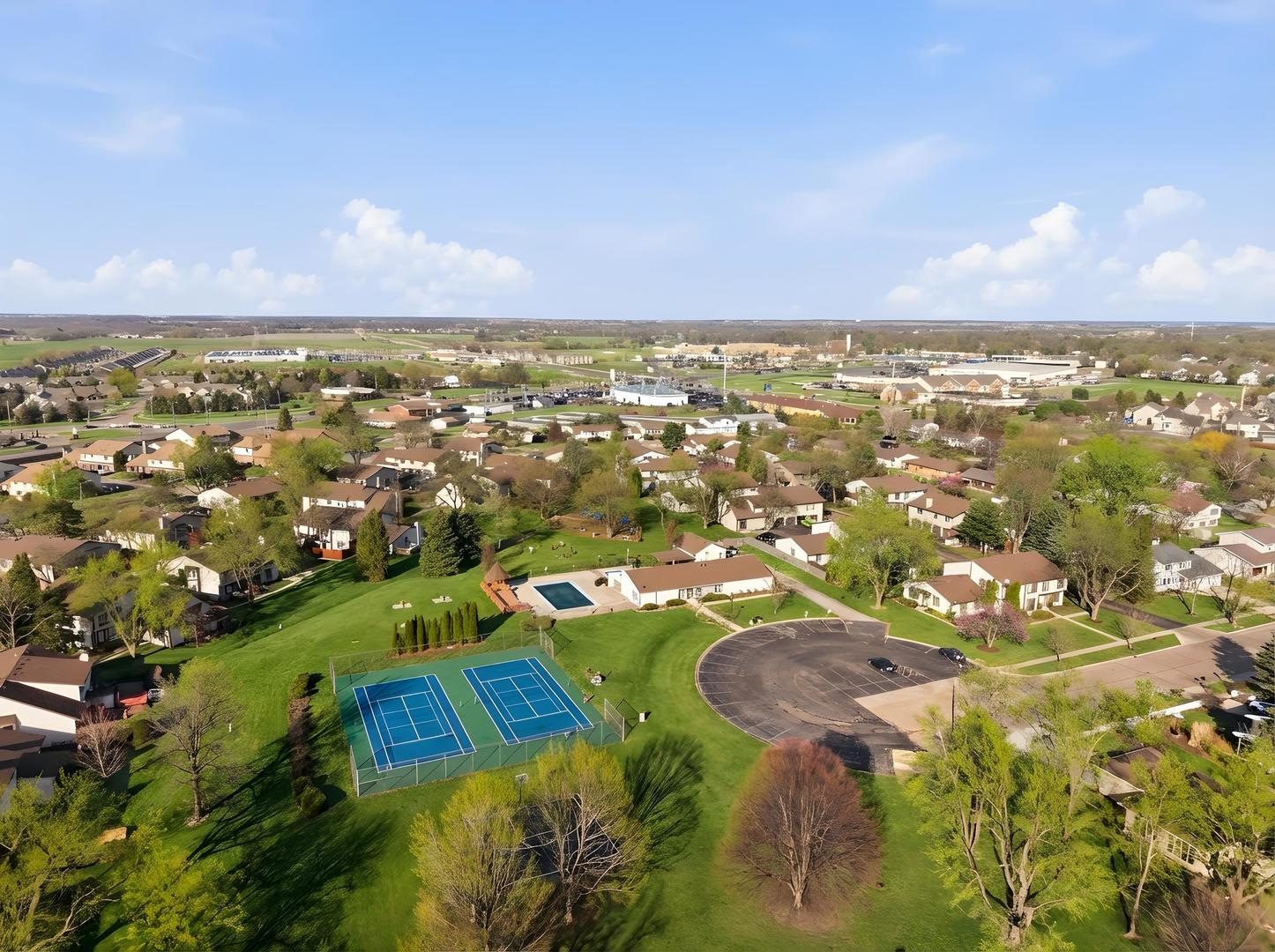 1729 Cedarbrook Court Sycamore, IL 60178 - Photo 8 of 36 an aerial view of residential houses with outdoor space and lake view