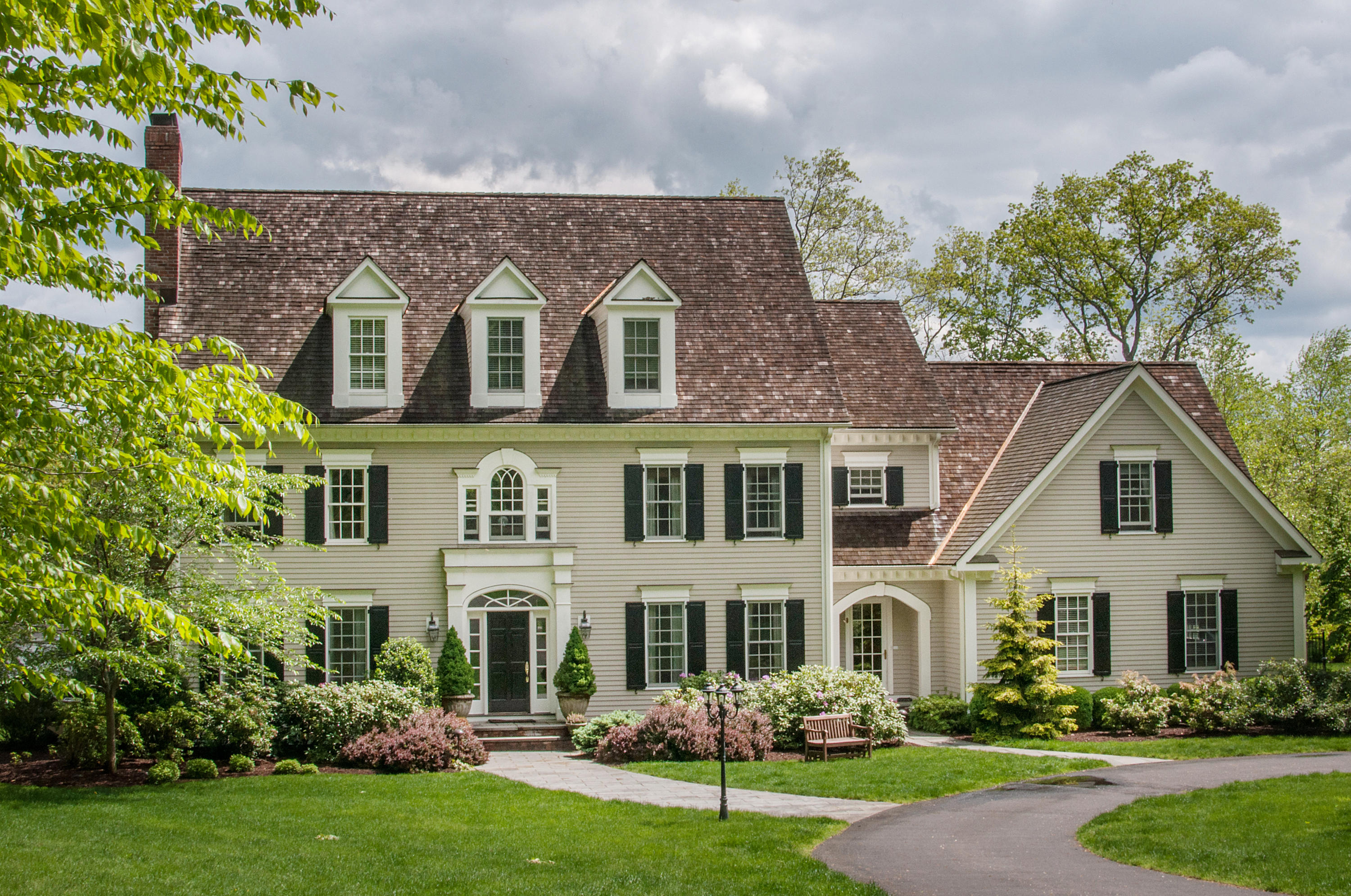 550 Brookside Road New Canaan, CT 06840 - Photo 1 of 32 front view of a house with a yard