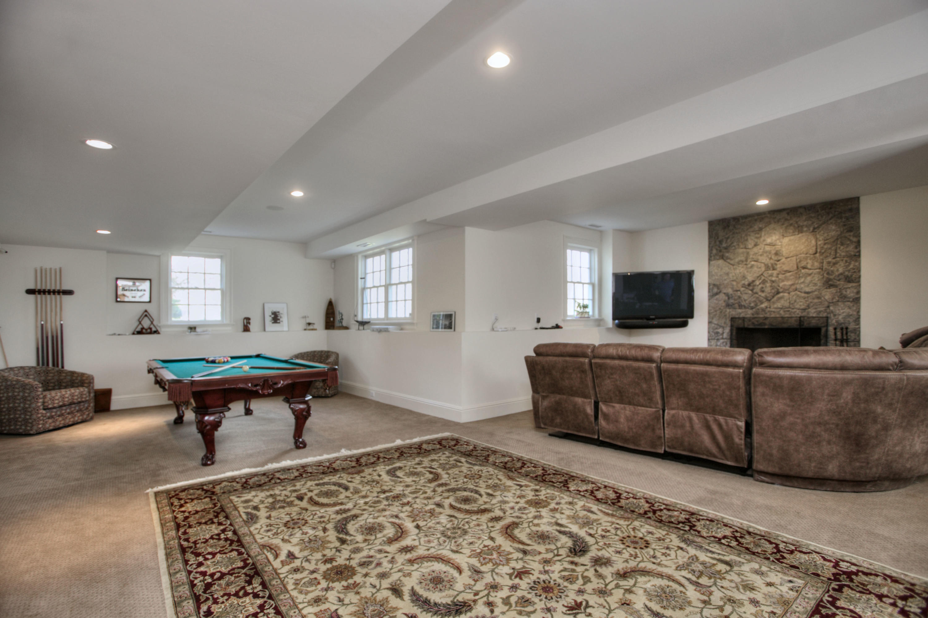 550 Brookside Road New Canaan, CT 06840 - Photo 23 of 32 a living room with furniture and a flat screen tv