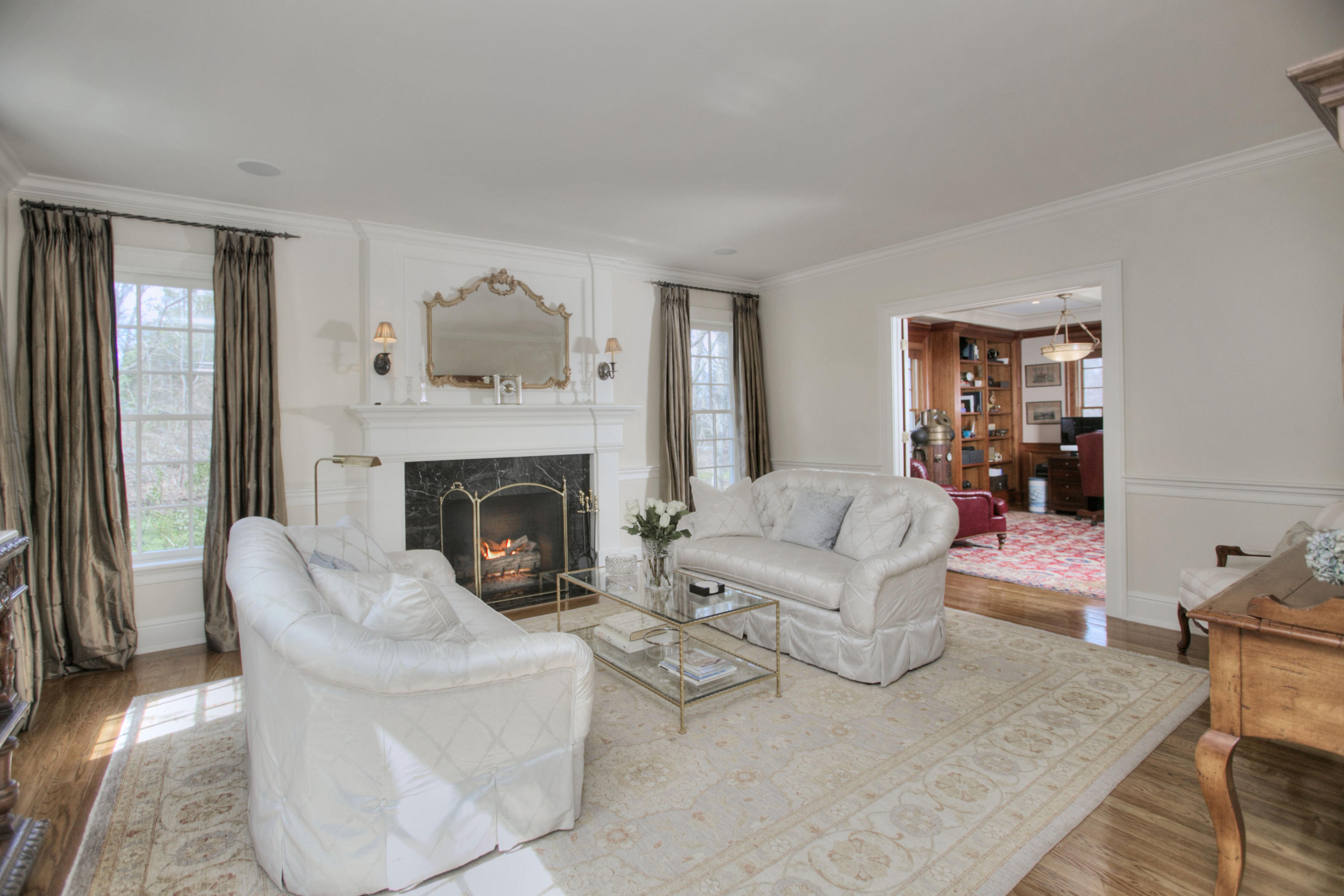 550 Brookside Road New Canaan, CT 06840 - Photo 5 of 32 a living room with furniture and a fireplace