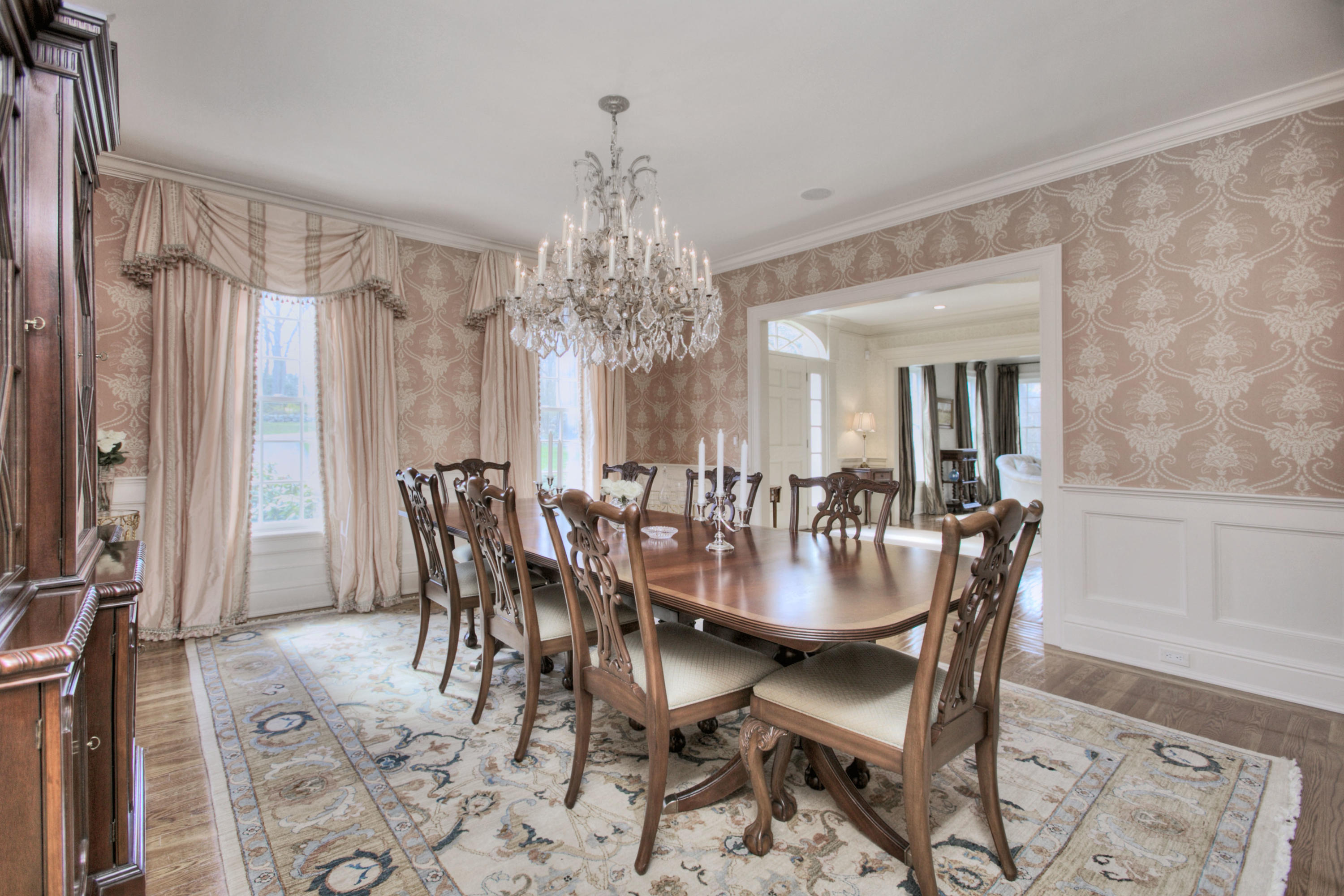 550 Brookside Road New Canaan, CT 06840 - Photo 7 of 32 a dining room with furniture a chandelier and wooden floor