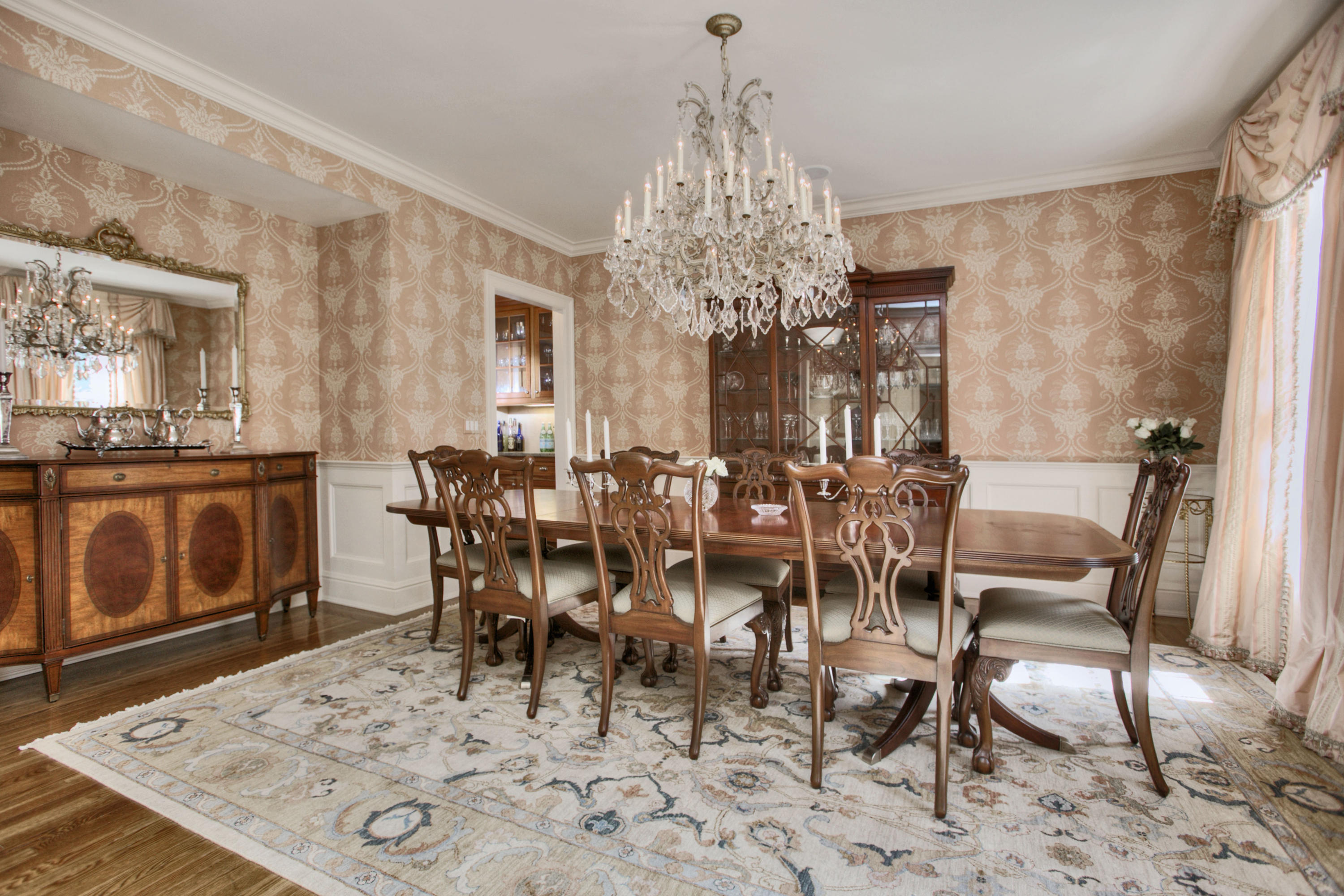 550 Brookside Road New Canaan, CT 06840 - Photo 8 of 32 a view of a dining room with furniture and chandelier