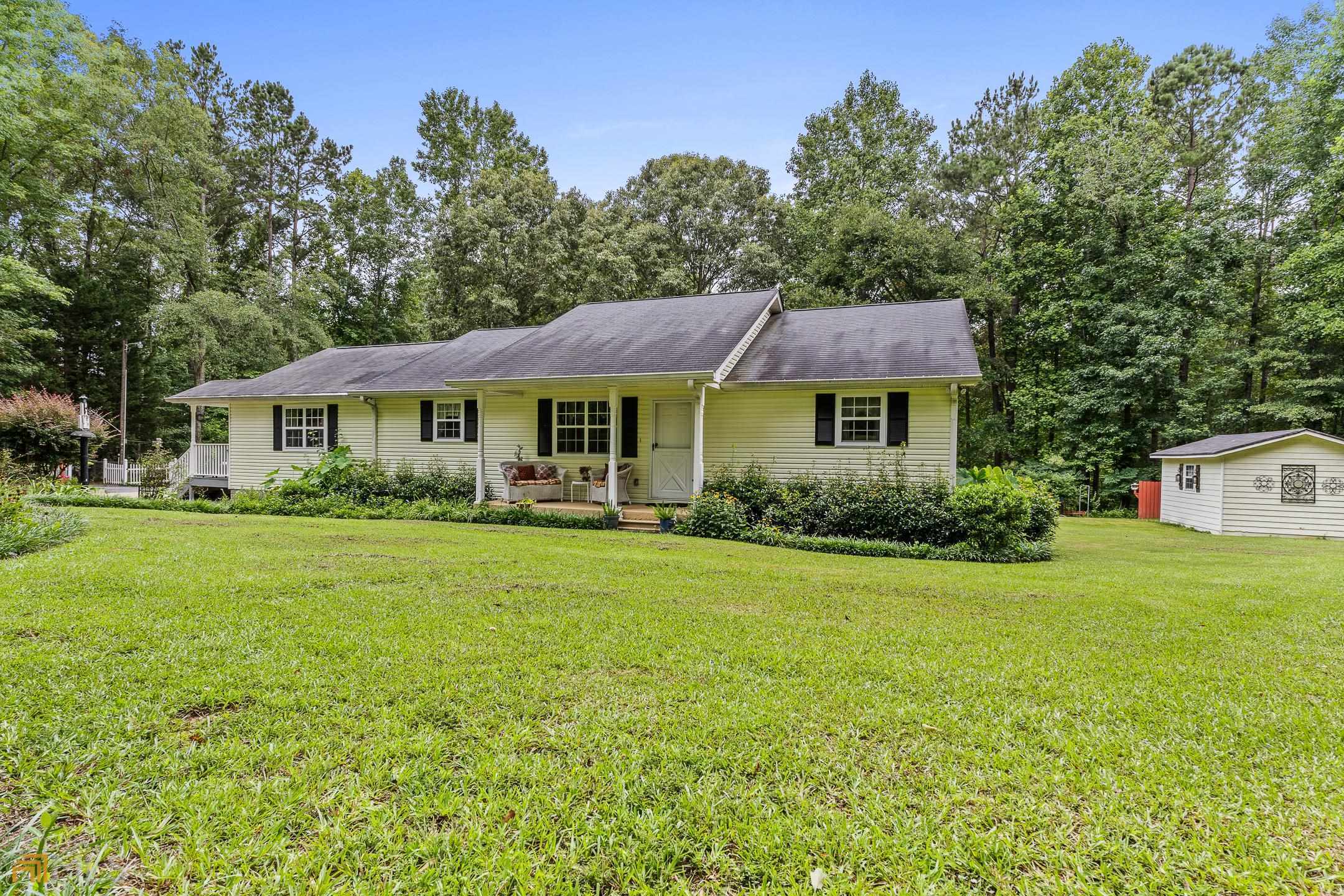 490 Hood Road Newnan, GA 30263 - Photo 1 of 1 a front view of a house with a yard