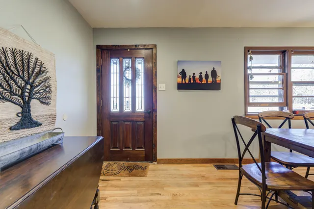 a view of a dining room with furniture and window