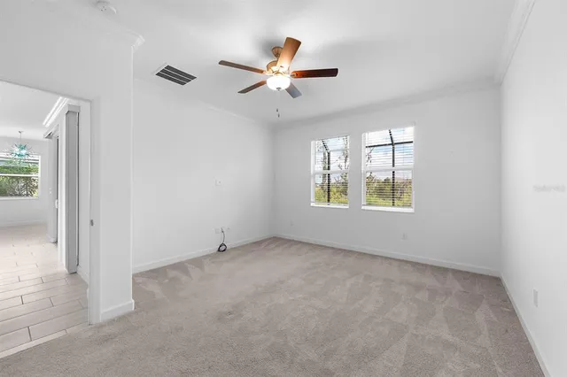 a spacious bathroom with a sink double vanity and a mirror
