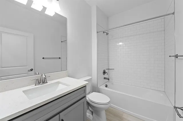 an empty room with chandelier fan