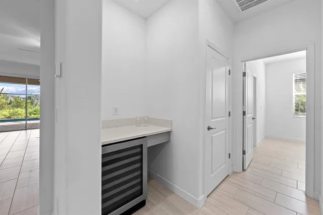 a view of a porch with a table and chairs