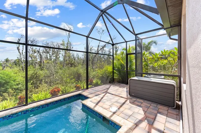 a view of an entryway with a floor to ceiling windows