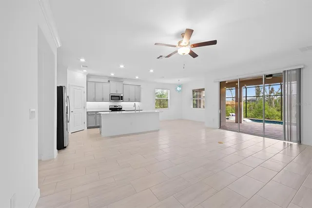 a view of a kitchen with a sink and a window