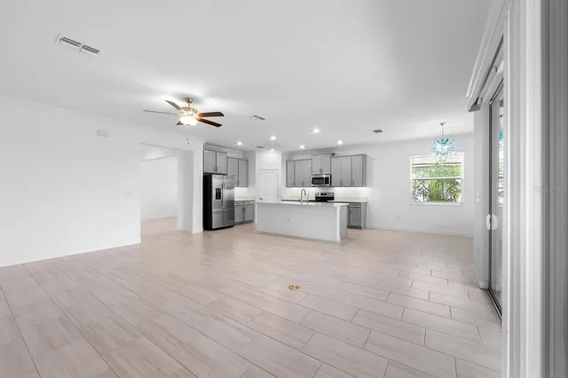 a view of a hallway to rooms