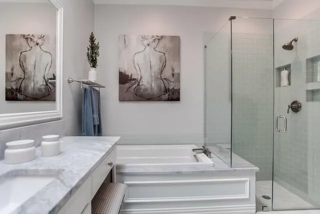 a bathroom with double sink and a mirror