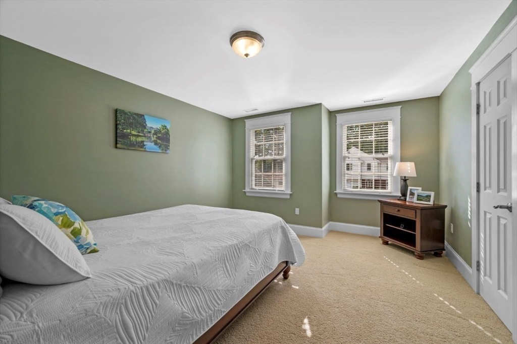 49 Columbia Road Arlington, MA 02474 - Photo 31 of 42 a bedroom with a bed and furniture