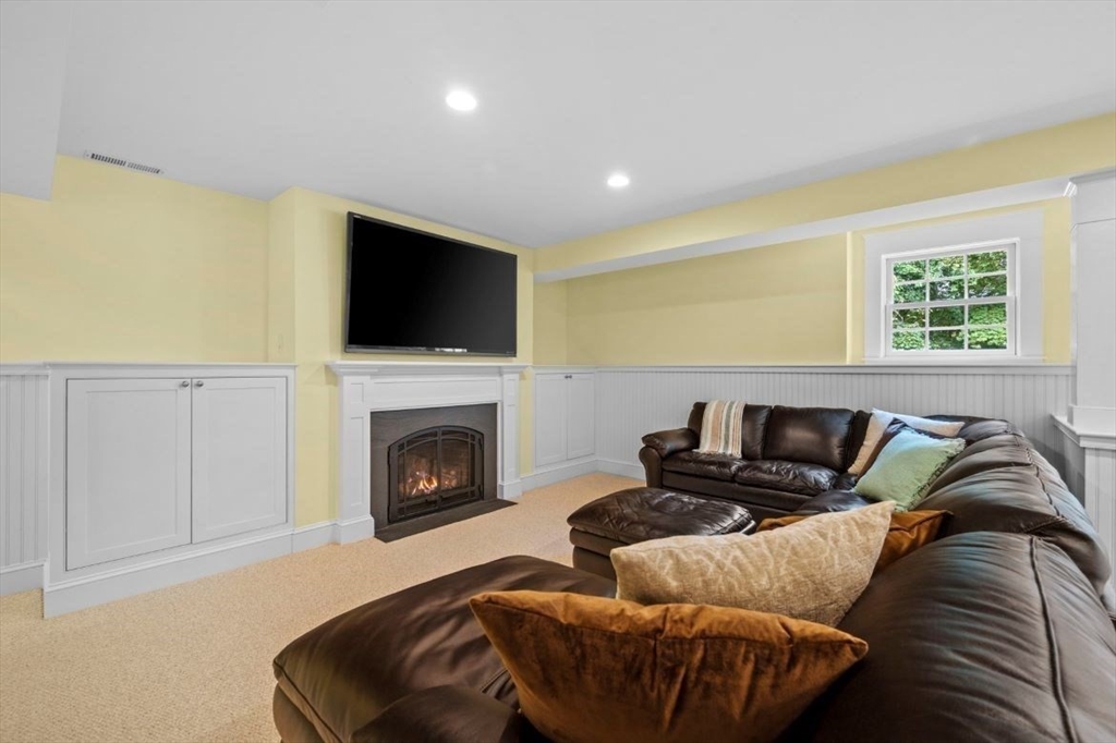 49 Columbia Road Arlington, MA 02474 - Photo 38 of 42 a living room with furniture and a flat screen tv