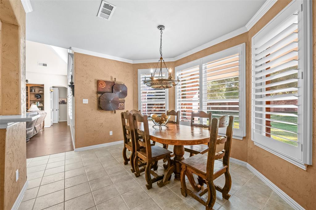 3904 Edna Valley Court Flower Mound, TX 75022 - Photo 12 of 36 a dining room with furniture and wooden floor