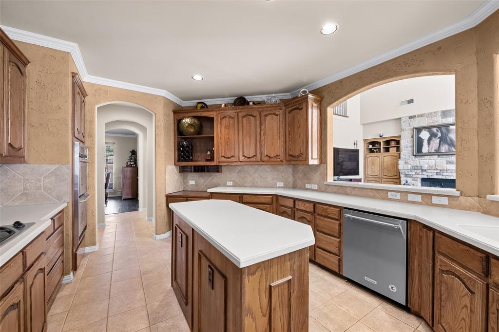 3904 Edna Valley Court Flower Mound, TX 75022 - Photo 14 of 36 a kitchen with a sink stove and cabinets
