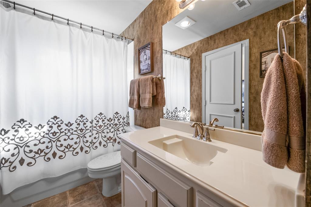 3904 Edna Valley Court Flower Mound, TX 75022 - Photo 25 of 36 a bathroom with a sink toilet and shower