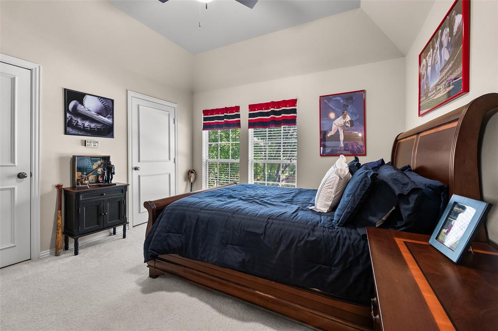 3904 Edna Valley Court Flower Mound, TX 75022 - Photo 28 of 36 a bed sitting in a bedroom next to a window