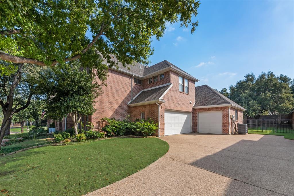 3904 Edna Valley Court Flower Mound, TX 75022 - Photo 30 of 36 a front view of a house with a garden