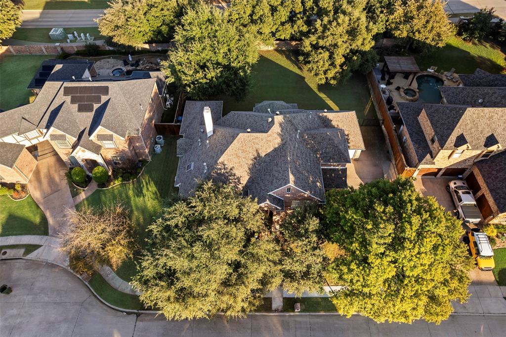 3904 Edna Valley Court Flower Mound, TX 75022 - Photo 36 of 36 an aerial view of a house with a yard and garden