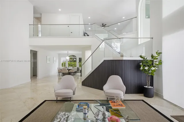 a large white kitchen with a large window