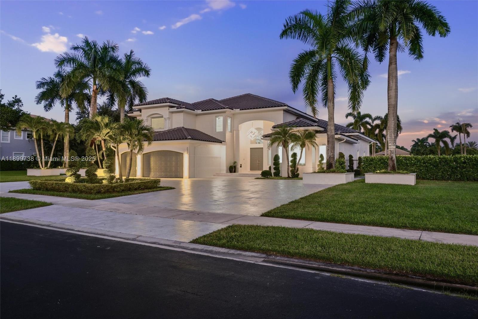 3526 Juniper Lane Davie, FL 33330 - Photo 2 of 79 a front view of a house with fountain and porch