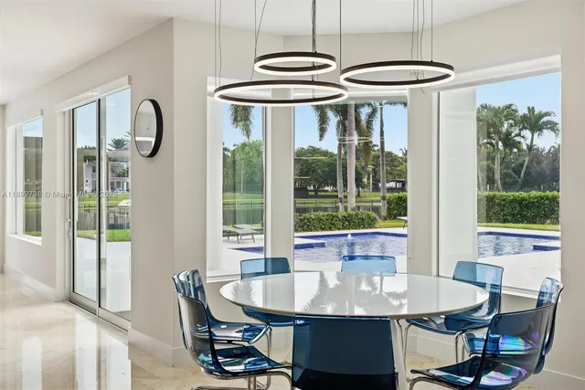 a view of entryway with a large window and wooden floor