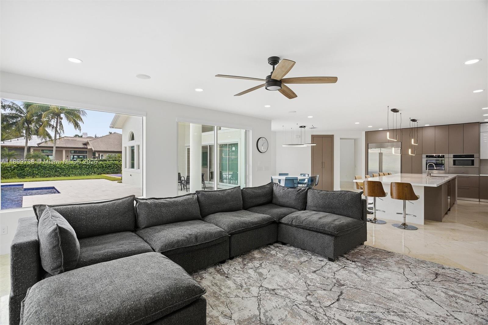 3526 Juniper Lane Davie, FL 33330 - Photo 23 of 79 a living room with furniture and a large window