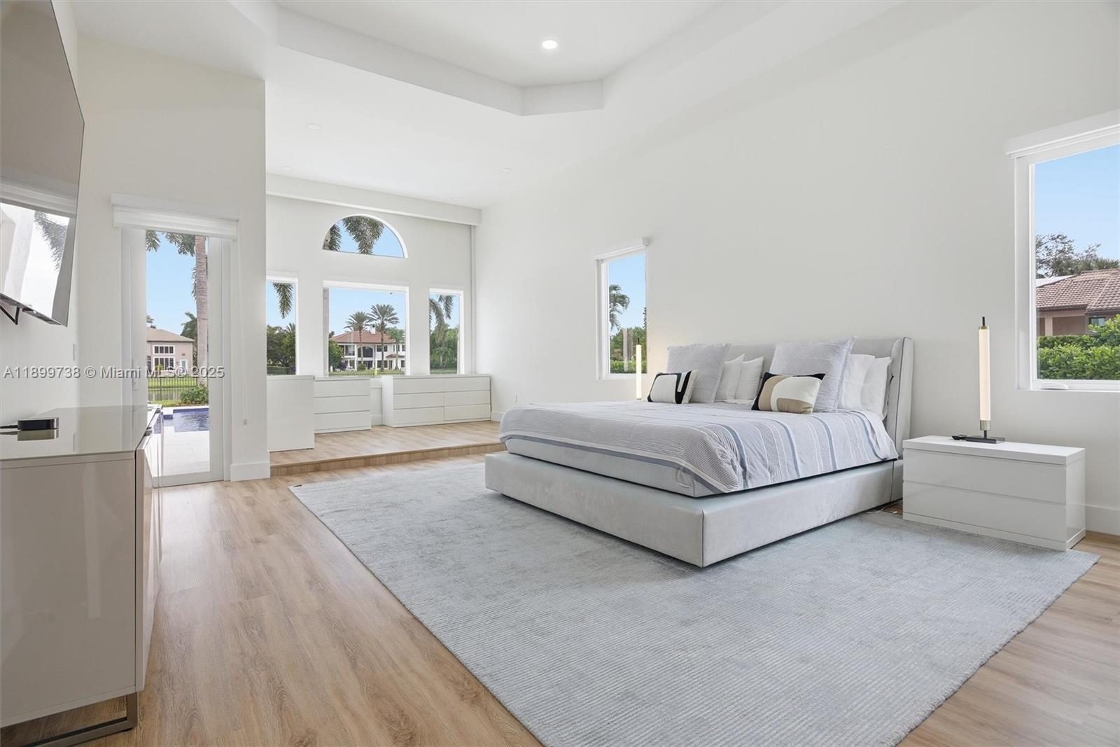 3526 Juniper Lane Davie, FL 33330 - Photo 27 of 79 a spacious bedroom with a bed and a couch