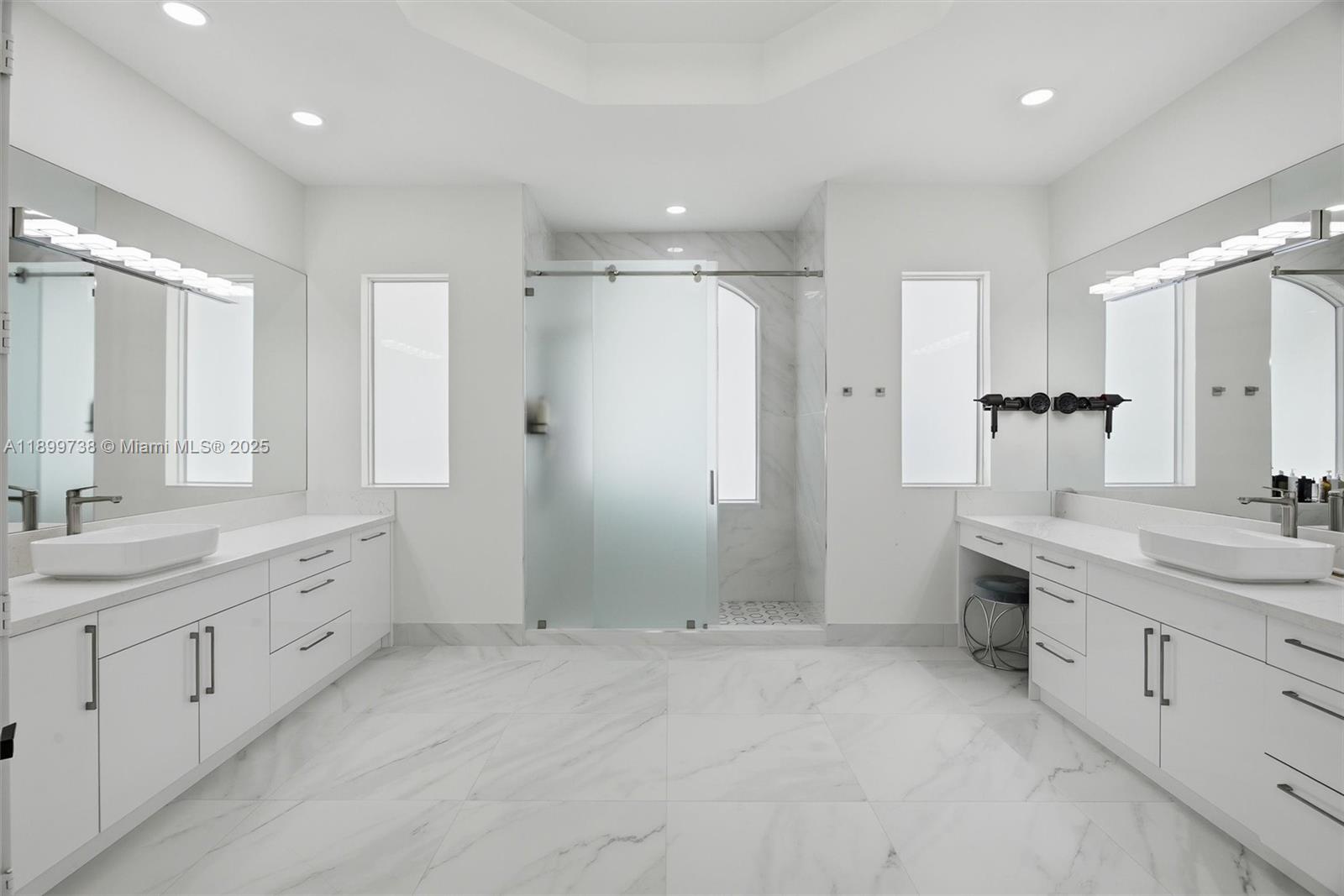 3526 Juniper Lane Davie, FL 33330 - Photo 31 of 79 a large bathroom with a granite countertop sink mirror and a