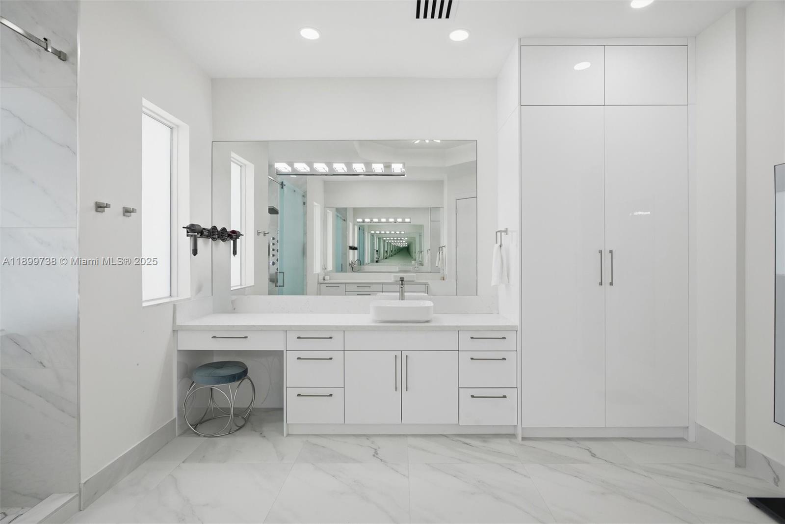 3526 Juniper Lane Davie, FL 33330 - Photo 32 of 79 a spacious bathroom with a granite countertop sink mirror and a