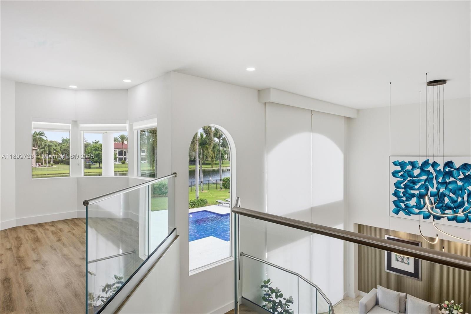 3526 Juniper Lane Davie, FL 33330 - Photo 35 of 79 a view of entryway with a large window and wooden floor