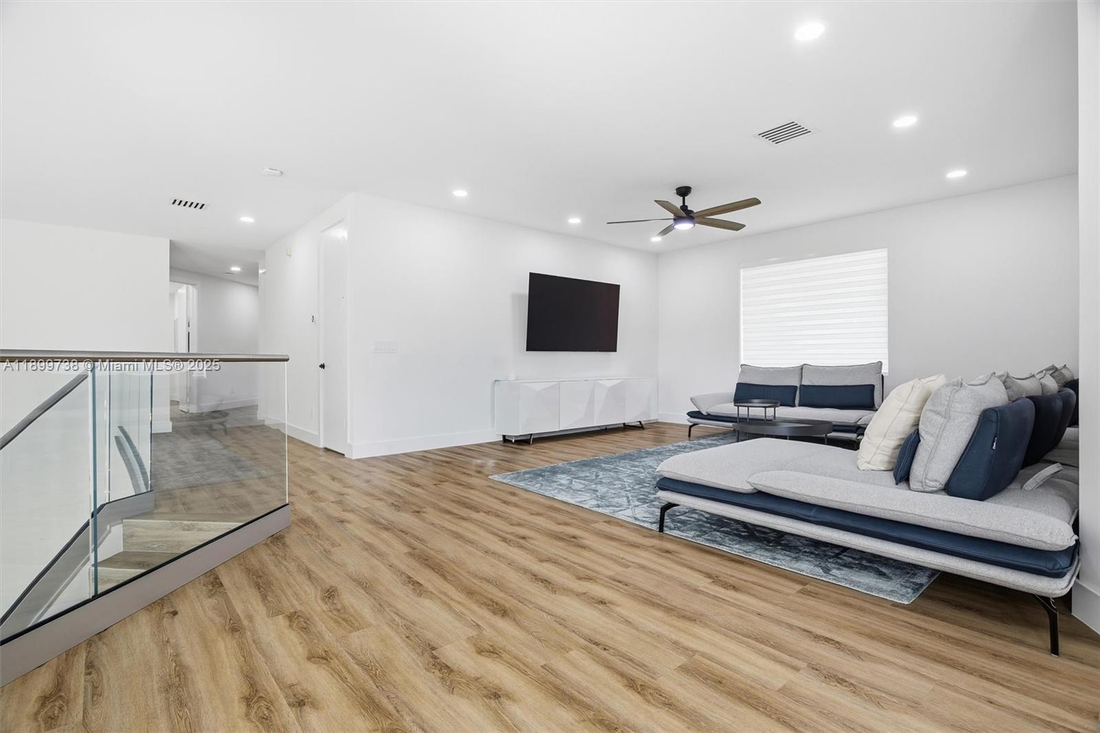 3526 Juniper Lane Davie, FL 33330 - Photo 37 of 79 a living room with furniture and a flat screen tv