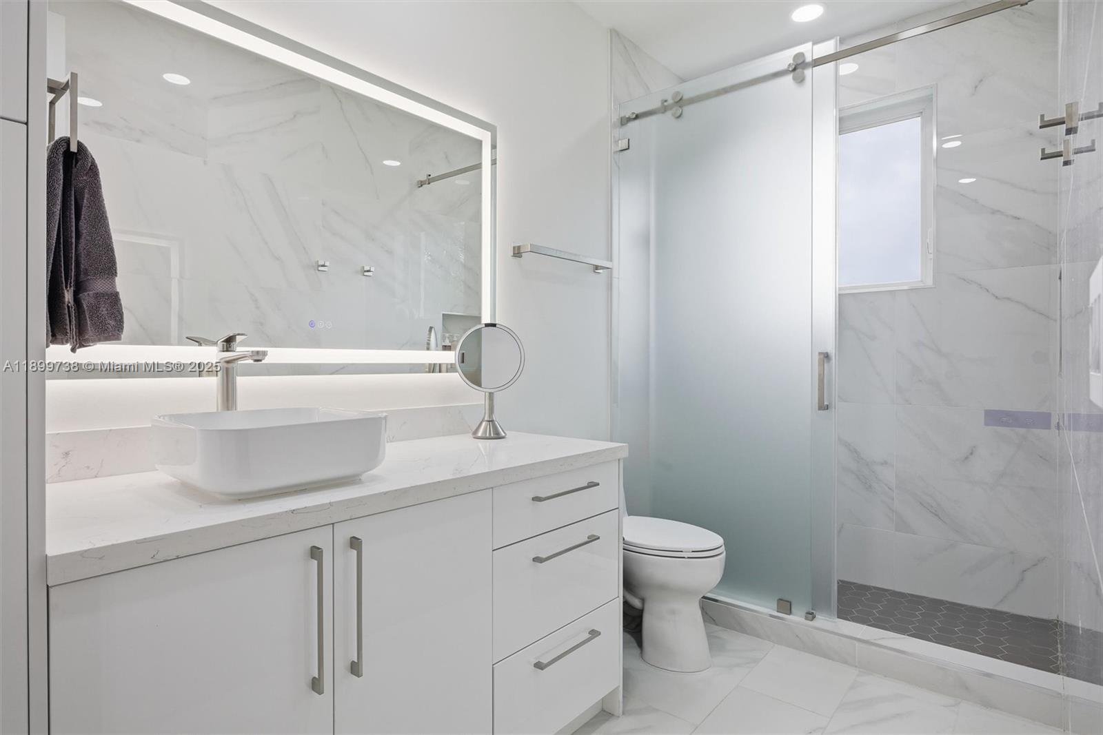 3526 Juniper Lane Davie, FL 33330 - Photo 42 of 79 a bathroom with a sink toilet double vanity and shower