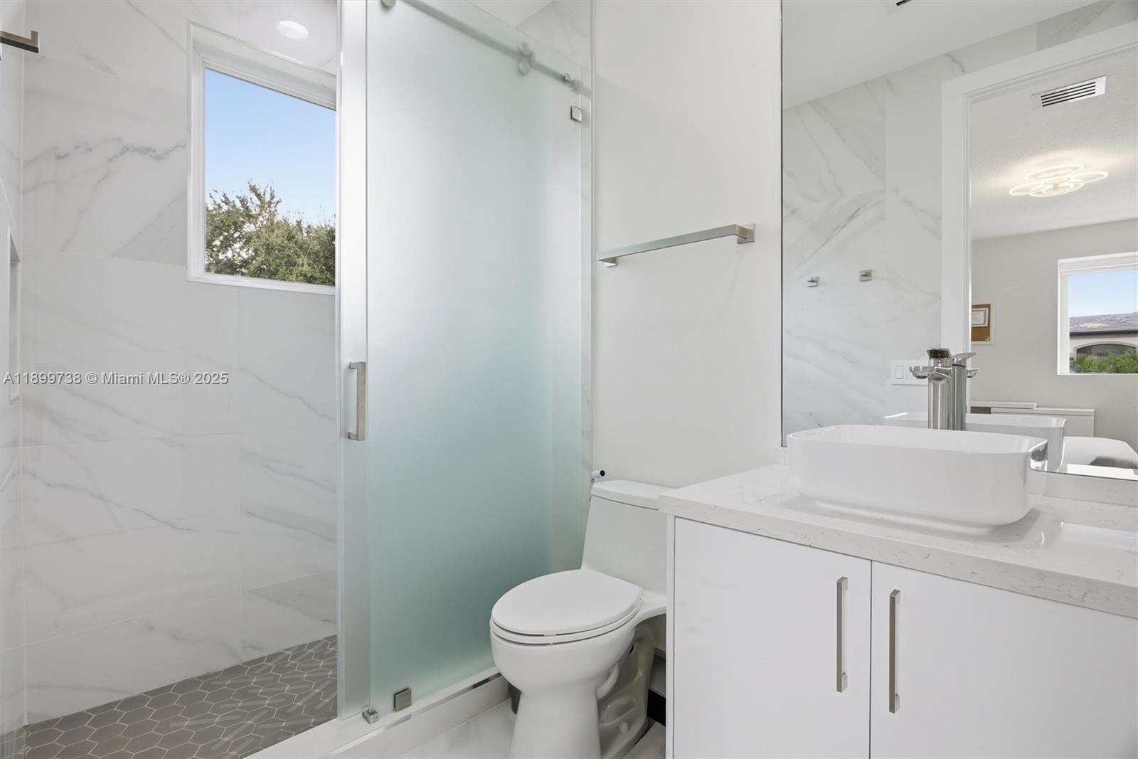 3526 Juniper Lane Davie, FL 33330 - Photo 45 of 79 a bathroom with a sink toilet and vanity