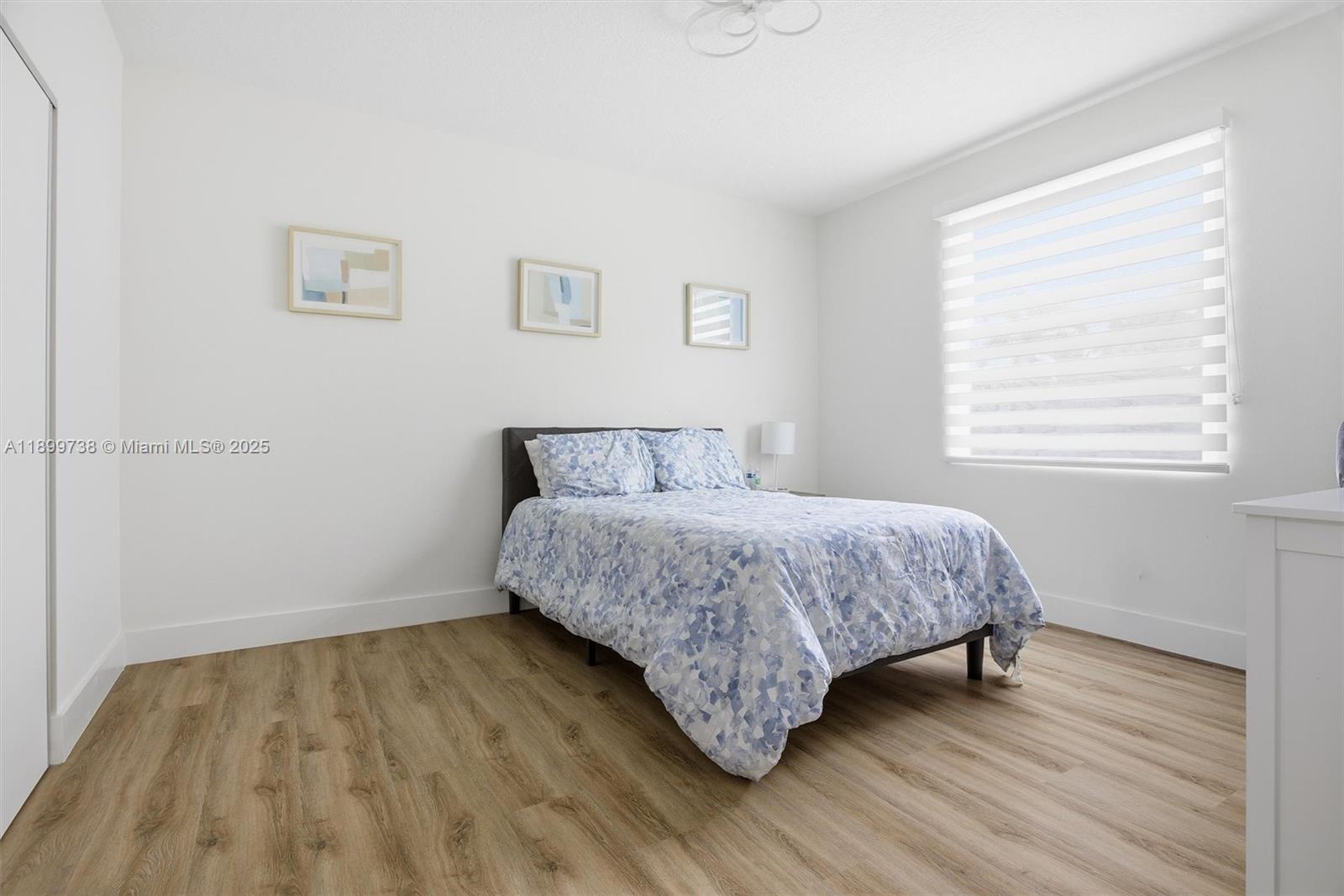 3526 Juniper Lane Davie, FL 33330 - Photo 46 of 79 a bedroom with a bed and a window