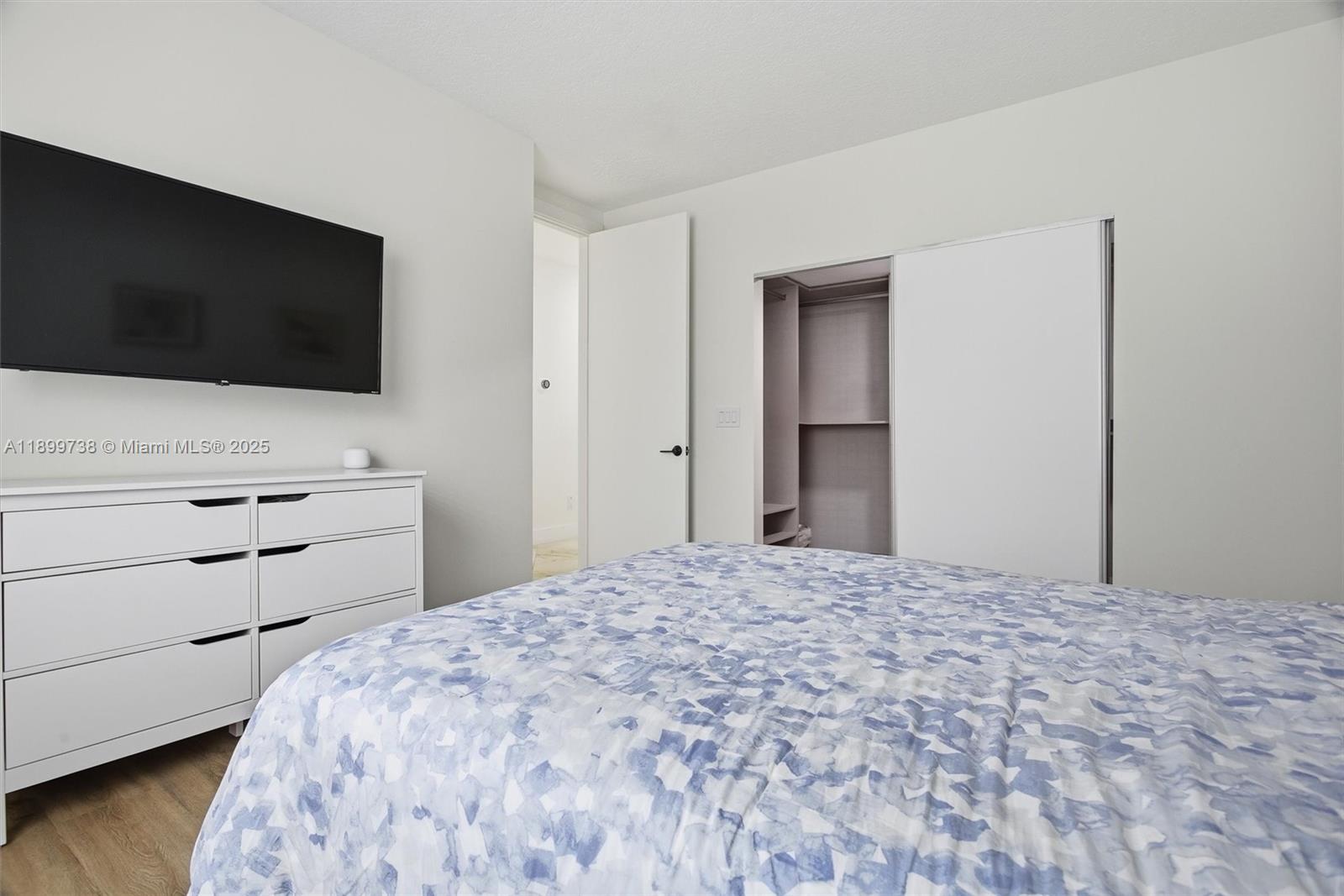 3526 Juniper Lane Davie, FL 33330 - Photo 47 of 79 a bedroom with a bed and a flat screen tv