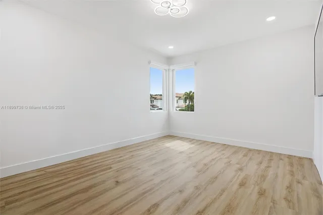 an aerial view of a house with a yard basket ball court and outdoor seating