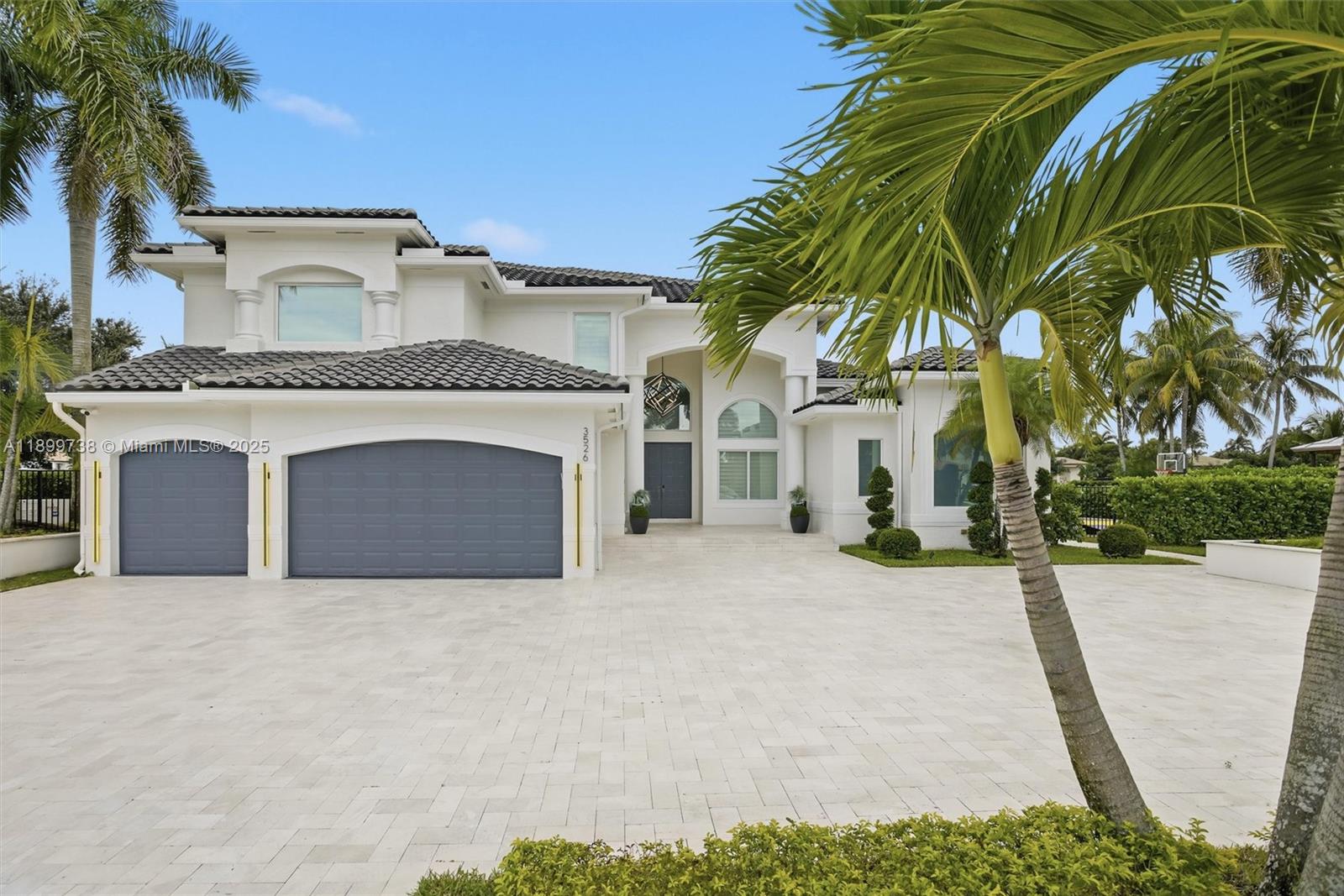 3526 Juniper Lane Davie, FL 33330 - Photo 6 of 79 a view of a house with a yard and palm trees