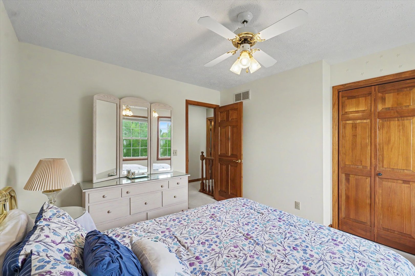 4409 Copper Ridge Road Champaign, IL 61822 - Photo 26 of 40 a bedroom with a large bed and a window