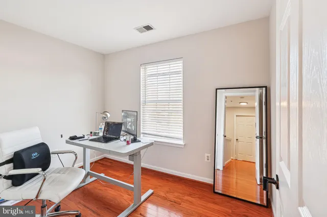 a room with furniture and wooden floor