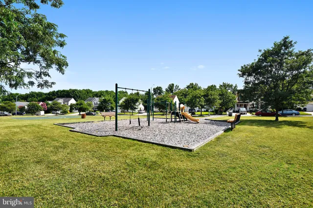 a view of a park with swings and slides